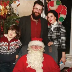  ??  ?? Santa with Kais and Rahaf Khachi and their son Nasr.