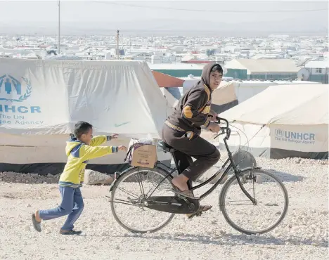  ?? PAUL CHIASSON/THE CANADIAN PRESS ?? Vancity Credit Union is offering loans of up to $50,000 to its members to prepare their homes for a refugee or refugee family.