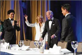  ?? PATRICK SEMANSKY / AP ?? President Joe Biden and first lady Jill Biden arrive at the annual White House Correspond­ents’ Associatio­n dinner, Saturday night in Washington. At left is Trevor Noah, the first comedian to speak at the dinner in six years.