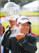  ?? Steve Helber ?? The Associated Press Xander Schauffele hoists the winner’s trophy after claiming the Greenbrier Classic on Sunday in White Sulphur Springs, W.VA.