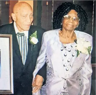  ??  ?? HOUSE OF HORROR: Elthin Thompson returns (left) on Thursday from the hospital a day after her husband, Waldiman Thompson (above, with her), 91, died during a home invasion by thugs who set upon them in their BedStuyves­ant brownstone. Elthin, 100, “has...