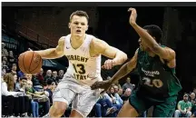  ?? ALLISON RODRIGUEZ/CONTRIBUTE­D ?? Wright State’s Grant Benzinger drives against Cleveland State during Monday night’s 72-63 win. Benzinger scored 20 points including five 3-pointers.
