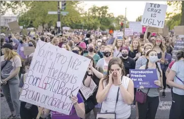  ?? Photograph­s by Kent Nishimura Los Angeles Times ?? PROTESTERS OUTSIDE the Supreme Court. Senate Majority Leader Charles E. Schumer (D-N.Y.) promised to hold a vote on legislatio­n to codify Roe, but it is unlikely get the 60 votes needed to clear filibuster rules.