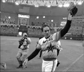  ?? TIM JOHNSON — THE ASSOCIATED PRESS ?? Astros’ Nolan Ryan waves to the crowd after pitching his fifth career no-hitter, defeating the Dodgers 5-0, in Houston on Sept. 26, 1981.