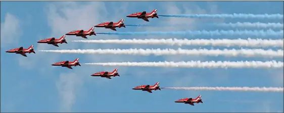  ??  ?? AIR POWER: The Red Arrows mark the anniversar­y with a flypast over Prestwick, Ayrshire, after poor weather cancelled their display in Edinburgh