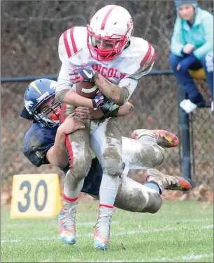  ?? Photo by Ernest A. Brown ?? Burrillvil­le’s Aidan Tupper (6) takes down Lincoln running back Isaiah Oviveira (2) during second-quarter action at Alumni Field Saturday.