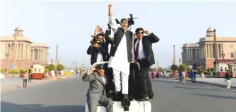  ?? — AFP ?? NEW DELHI: Indian children’s right activist and Nobel Laureate, Kailash Satyarthi (C) gestures towards children at an event in New Delhi yesterday.