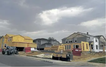  ?? Rachel Ellis, The Denver Post ?? Workers build homes at the Painted Prairie developmen­t in Aurora last month. Government­s along the Front Range have approved permits allowing constructi­on of thousands of homes, forcing new efforts to move water across the mountains to satisfy growing demand.