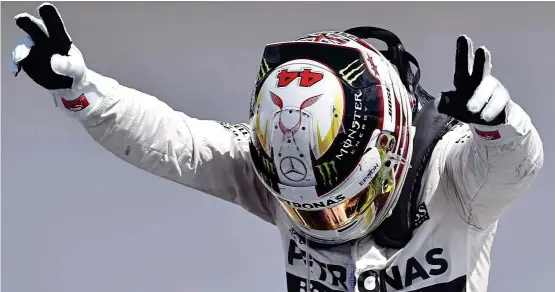  ??  ?? giving thanks: Mercedes’ lewis Hamilton bowing to his home fans after winning the British Formula one Grand Prix at Silverston­e yesterday. See report on Page 38