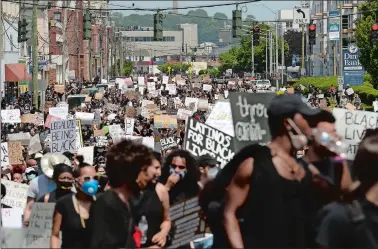  ?? DANA JENSEN/THE DAY ?? People march up Bank Street while participat­ing in the “We’re Fed Up! Black Lives Matter Protest” on Saturday in New London.