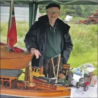  ??  ?? John Findlay of Lorn Model and Model Engineerin­g Club with the boats on display.