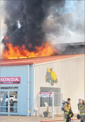  ??  ?? Flames reached the roof while the small motor repairs workshop was completely gutted. Photos: File