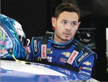  ??  ?? Kyle Larson climbs into his car for practice at the NASCAR Daytona 500 in Daytona Beach, Fla. on Feb. 14.