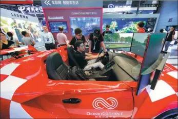  ?? CHENG JIABEI / FOR CHINA DAILY ?? A futuristic concept car at the 2018 World Internet of Things Expo in Wuxi, Jiangsu province, last month is equipped with Internet of Vehicles technology, which collects and analyzes traffic and driving data.