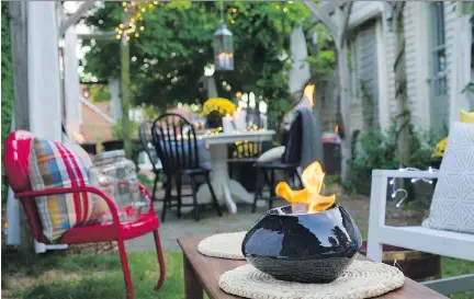  ?? GRAHAM HUGHES ?? It’s not hard to imagine being swept away by the country charm of this backyard, which belongs to Mark LeGassick and Colleen Jorgensen. Time spent in the yard, even after summer ends, is time well spent.