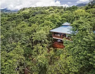  ?? Secret Bay photos ?? Above: Secret Bay Resort’s treehouse villas, in Dominica, are luxe and secluded but keep a small footprint. Left: Villa guests can enjoy a private pool.