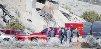  ??  ?? Officials last month at the abandoned mine where the bodies were discovered.