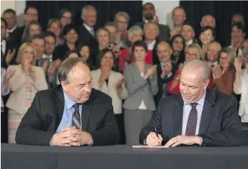  ?? CHAD HIPOLITO/THE CANADIAN PRESS/FILES ?? A promise to ban union and corporate donations to political parties is part of a power-sharing deal signed May 30 by Green leader Andrew Weaver and NDP Premier John Horgan.