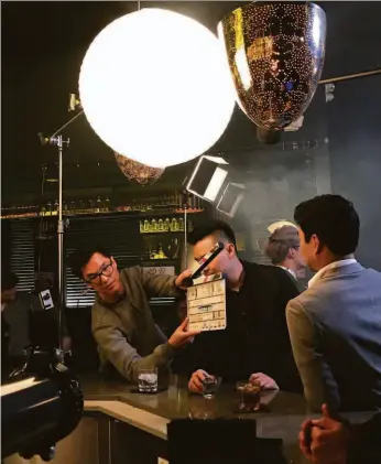  ?? Wong Fu Production­s photos ?? Wong Fu Production­s co-founder Wesley Chan (left) on the set of “Yappie,” which stars fellow co-founder Philip Wang (center) and Simu Liu.