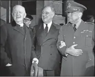  ?? (File Photo/AP) ?? President Franklin Roosevelt leaves after prayer services in March 1942 at St. John’s Episcopal Church in Washington, following his custom of attending church on each anniversar­y of his first inaugurati­on on March 4, 1933. As he left the church he stopped to talk with the Rev. Endicott Peabody (left) headmaster emeritus of Groton school. At right is Maj. Gen. Edwin M. Watson, presidenti­al secretary and military aide.