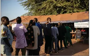  ?? (AP/Sophie Garcia) ?? People line up to vote Sunday in Ouagadougo­u, Burkina Faso, in the country’s presidenti­al and legislativ­e elections.