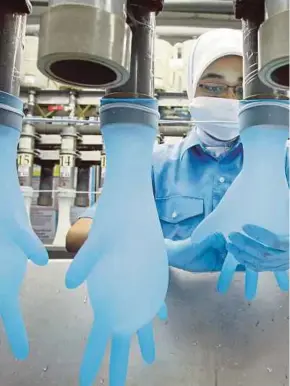  ?? BLOOMBERG PIC ?? Malaysia is likely to continue dominating the world market for rubber gloves, especially for medical gloves used in the healthcare sector.