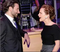  ??  ?? Fancy seeing you! She chats to Bradley Cooper