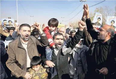  ??  ?? Iranian worshipper­s chant slogans during a rally against anti-government protesters after the Friday prayer ceremony in Tehran, Iran, last week.