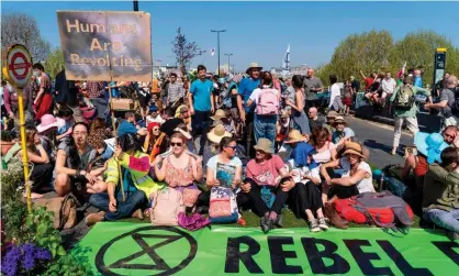  ??  ?? Extinction Rebellion protesters on Waterloo Bridge, London, April 2019. ‘This is what we have been waiting for, yet strangely the reaction within the scientific community has been muted.’ Photograph: Niklas Halle’n/AFP/Getty Images