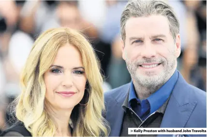  ??  ?? > Kelly Preston with husband John Travolta