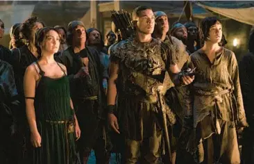  ?? AMAZON PRIME VIDEO PHOTOS ?? ABOVE: Nazanin Boniadi, from left, Ismael Cruz Cordova and Tyroe Muhafidin in “The Lord of the Rings: The Rings of Power.” BELOW: Morfydd Clark as the Elvin commander Galadriel.