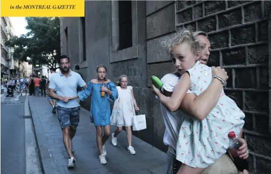  ?? GIANNIS PAPANIKOS / THE ASSOCIATED PRESS ?? People flee the scene in Barcelona, Spain, on Thursday after a white van jumped the sidewalk in the historic Las Ramblas tourist district, crashing into pedestrian­s.