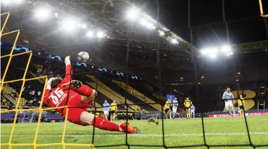  ?? Photo / AP ?? Riyad Mahrez puts Man City in control by blasting his 55th-minute spot kick into the top right corner.