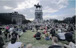  ?? BOB BROWN/ASSOCIATED PRESS ?? Following days of unrest in Richmond, Gov. Ralph Northam and Mayor Levar Stoney announced Thursday that the statue of Confederat­e Gen. Robert E. Lee overlookin­g the capital would be removed from its pedestal.