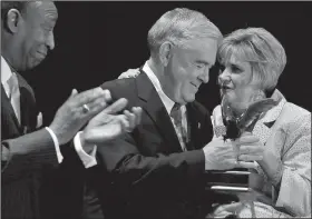  ?? File Photo/NWA Democrat-Gazette ?? Coleman Peterson, (left) Northwest Arkansas Community College board chairman, and NWACC President Becky Paneitz (right) hand Dick Barclay an award in April 2009 for being honored with a Quality of Life Award for his dedication and service to the community and to NWACC at the John Q. Hammons Center in Rogers.