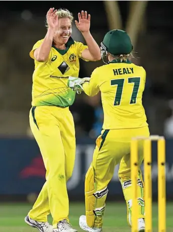  ?? Photo: DEAN LEWINS ?? WICKET TAKER: Australia’s Delissa Kimmince celebrates her LBW wicket of England’s Natalie Sciver during the first Womens Ashes T20 match in Sydney last year.