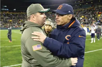  ?? MORRY GASH/AP ?? Losing 55-14 to coach Mike McCarthy (left) and the Packers after a bye in 2014 helped seal the fate of Bears coach Marc Trestman (right) and general manager Phil Emery.