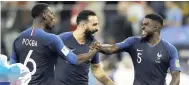  ?? FILE ?? France’s Samuel Umtiti (right) celebrates with teammates Adil Rami (centre) and Paul Pogba after defeating Belgium 1-0 to advance to the World Cup final.