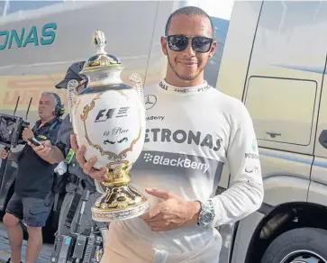  ?? EPA ?? Mercedes driver Lewis Hamilton celebrates victory in the Hungarian Grand Prix on Sunday.