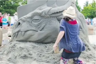  ?? WENDY SEARS ?? A sand artist at work at the 2019 Parksville Beachfest. The popular event will be back on this summer from July 15 to Aug. 21, featuring the sand-sculpting competitio­n, artisan market, buskers, music events and a light show.