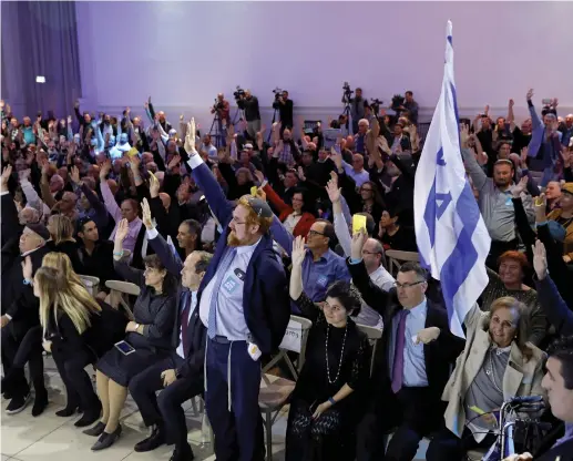  ?? (Amir Cohen/Reuters) ?? LIKUD PARTY MEMBERS vote during a Likud Central Committee meeting in Airport City last year.