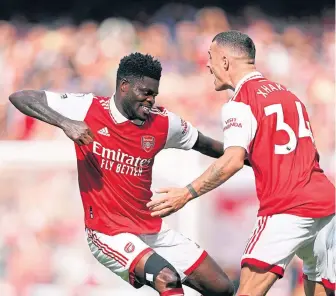  ?? ?? Thomas Partey celebrates with and Granit Xhaka after scoring against Spurs last weekend