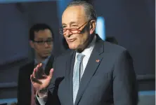  ?? Saul Loeb / AFP / Getty Images 2019 ?? Senate Minority Leader Chuck Schumer says, “Big help, quick help, is on the way” in the economic stimulus package.