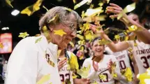  ?? Scott Strazzante/Associated Press ?? Stanford head coach Tara VanDerveer is congratula­ted by her team after their victory over Oregon State Sunday in Stanford, Calif. VanDerveer broke the college basketball record for wins.