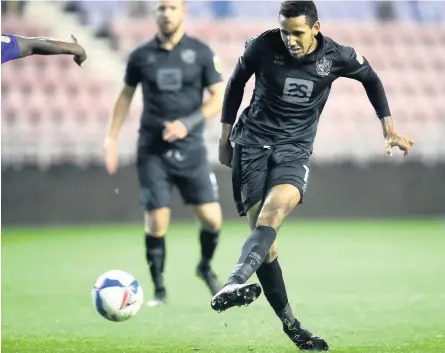  ??  ?? MONTY ON THE MARK: Cristian Montano scores his side’s third goal of the game in last night’s EFL Trophy match. And then, below, celebrates with teammates as his side moved to the brink of qualificat­ion with last night’s impressive 3-1 victory.