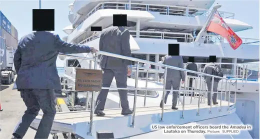  ?? Picture: SUPPLIED ?? US law enforcemen­t officers board the Amadea in Lautoka on Thursday.