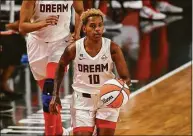  ?? Icon Sportswire / via Getty Images ?? Guard Courtney Williams, seen here with the Atlanta Dream, is back with the Sun this season.