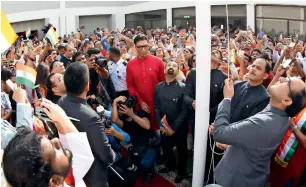  ?? Photos by Juidin Bernarrd and Ryan Lim ?? FOR FLAG AND COUNTRY: Vipul hoists the Indian national flag at the consulate as part of the 73rd Independen­ce Day celebratio­ns in Dubai. —