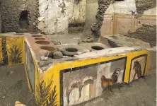  ?? Luigi Spina / Pompeii Archaeolog­ical Park ?? A thermopoli­um — or snack bar — has been excavated at Pompeii, which was buried in A. D. 79 by volcanic debris.