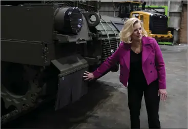  ?? PHOTOS BY: CARLOS OSORIO — THE ASSOCIATED PRESS ?? Secretary of the Army Christine Wormuth looks over the latest version of the M1A2Abrams main battle tank as she tours the Joint Systems Manufactur­ing Center in Lima, Ohio.